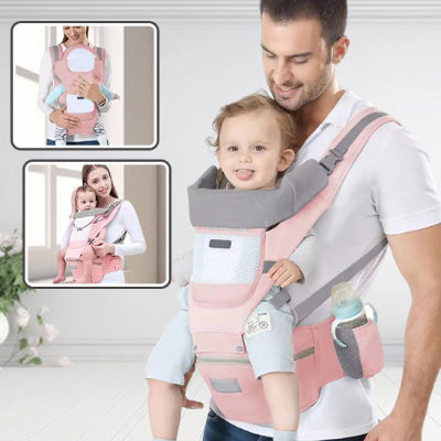 parents avec filles dans porte bebe rose